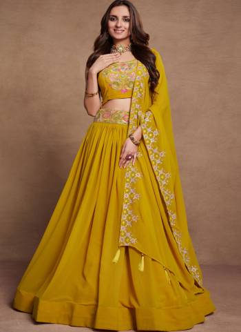 For A Designer Look,Grab These Lehenga Choli in Fine Colored.These Lehenga Are Georgette And Dupatta Are Fabricated On Georgette Pair With Georgette Blouse.Its Beautified With Blooming Color,Designer Thread,Sequance Embroidery Work.