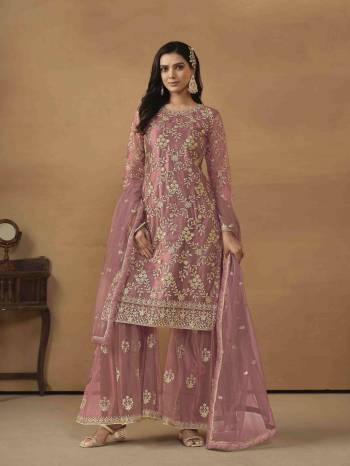 Garb These Party Wear Sharara Suit in Fine Colored Pair With Bottom And Dupatta.These Top And Dupatta Are Fabricated On Net Pair With Satin/Net Bottom.Its Beautified With Satin Inner.Its Beautified With Designer Heavy Sequance Embroidery Work.