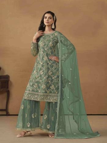 Garb These Party Wear Sharara Suit in Fine Colored Pair With Bottom And Dupatta.These Top And Dupatta Are Fabricated On Net Pair With Satin/Net Bottom.Its Beautified With Satin Inner.Its Beautified With Designer Heavy Sequance Embroidery Work.