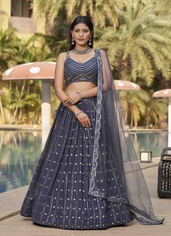 For A Designer Look,Grab These Lehenga Choli in Fine Colored.These Lehenga Are Georgette And Blouse Are Fabricated On Georgette Pair With Dupatta Are Soft Net.Its Beautified With Designer Jari,Sequance Embroidery Work.