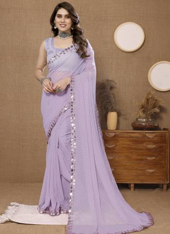 Attrective Look These Saree in Fine Colored.These Saree Are Soft Chiffon And Blouse is Mono Banglori Fabricated.Its Beautified With Wevon Butti Designer With Mirror Embroidery Work Lace Border.