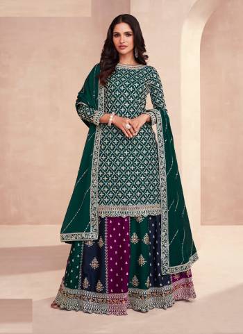 Garb These Designer Gharara Suits in Fine Colored Pair With Dupatta.These Top And Dupatta Are Fabricated On Chinon Pair With Chinon Bottom.Its Beautified With Designer Embroidery Work