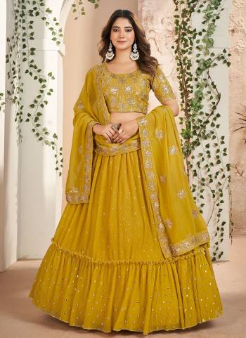 For A Designer Look,Grab These Lehenga Choli in Fine Colored.These Lehenga Are Faux Georgette And Dupatta Are Fabricated On Faux Georgette Pair With Faux Georgette Blouse.Its Beautified With Designer Thread,Sequance Embroidery Work.