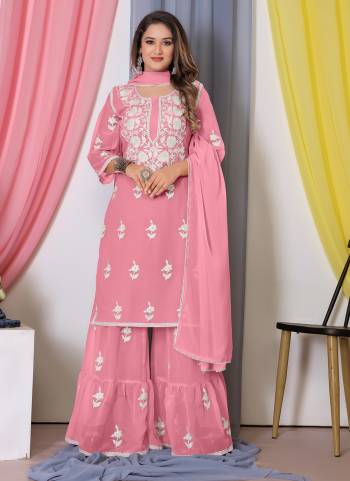 Attrective These Sharara Suit in Fine Colored Pair With Bottom And Dupatta.These Top Are Bamber Georgette And Dupatta Are Fabricated On Georgette Pair With Bamber Georgette Bottom.Its Beautified With Designer Heavy Cotton Thread Embroidery Work.