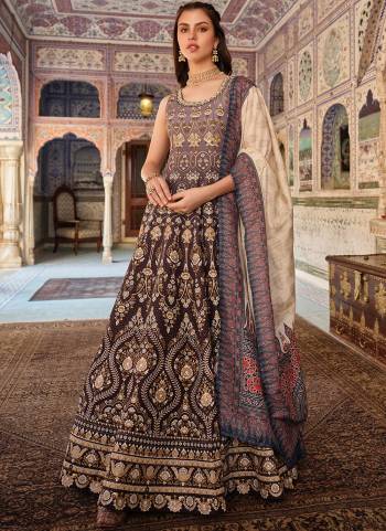 Attrective Looking These Beautiful Looking Readymade Gown With Dupatta.These Gown Are Dolla Silk And Dupatta is Fabricated On Muslin.Its Beautified With Wevon Butti Designer With Printed,Swarovski With Leather Work.