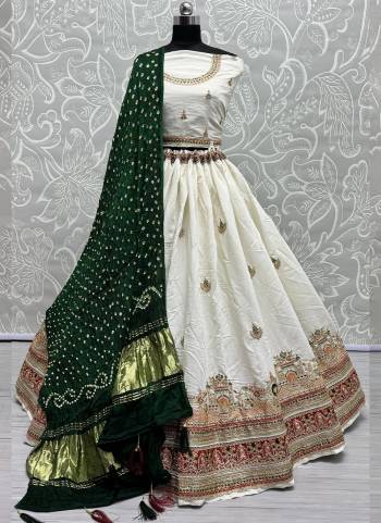 For A Fancy Designer Look,Grab These Lehenga Choli With Dupatta in Fine Colored.These Lehenga And Choli Are Gadhwal Silk And Dupatta Are Fabricated On Gajji Silk Pair.Its Beautified With Designer Hand Knitting Bandhej Dupatta With Cotton Thread Lakhnavi Embroidery Work.