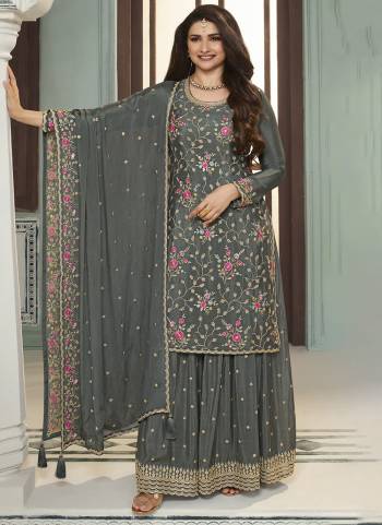 Garb These Designer Sharara Suits in Fine Colored Pair With Dupatta.These Top And Dupatta Are Fabricated On Chinon Pair With Chinon Bottom.Its Beautified With Blomming Color,Designer Thread,Sequance Embroidery Work