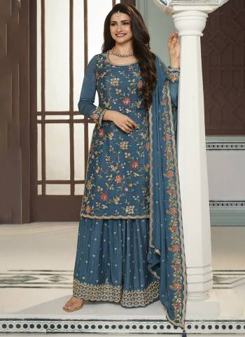 Garb These Designer Sharara Suits in Fine Colored Pair With Dupatta.These Top And Dupatta Are Fabricated On Chinon Pair With Chinon Bottom.Its Beautified With Blomming Color,Designer Thread,Sequance Embroidery Work