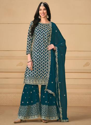 Garb These Party Wear Sharara Suit in Fine Colored Pair With Bottom And Dupatta.These Top And Dupatta Are Fabricated On Faux Georgette Pair With Faux Georgette Bottom.Its Beautified With Santoon Inner.Its Beautified With Designer Heavy Sequance Embroidery Work.