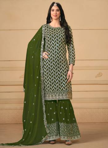 Garb These Party Wear Sharara Suit in Fine Colored Pair With Bottom And Dupatta.These Top And Dupatta Are Fabricated On Faux Georgette Pair With Faux Georgette Bottom.Its Beautified With Santoon Inner.Its Beautified With Designer Heavy Sequance Embroidery Work.