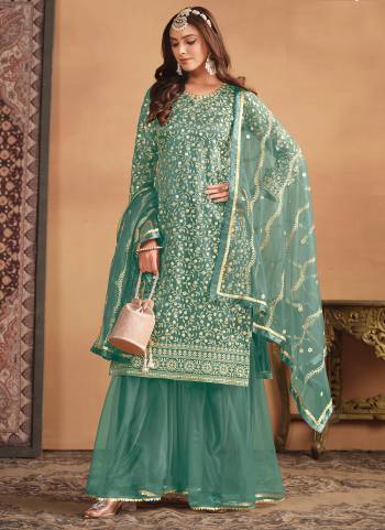 Garb These Party Wear Sharara Suit in Fine Colored Pair With Bottom And Dupatta.These Top And Dupatta Are Fabricated On Net Pair With Net Bottom.Its Beautified With Satin Inner.Its Beautified With Designer Heavy Sequaince Embroidery Work.