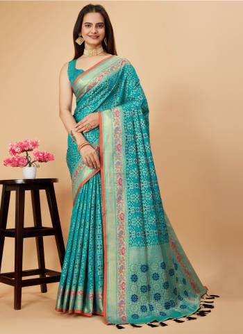 Garb This Partywear Saree Paired With Blouse.This Saree And Blouse Are Patola Silk Based Fabric With Weaving Jacquard Minakari Designer. Buy This Pretty Saree Now.