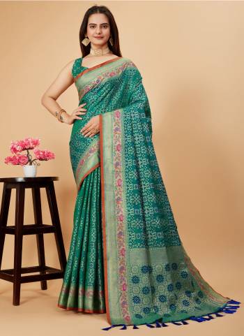 Garb This Partywear Saree Paired With Blouse.This Saree And Blouse Are Patola Silk Based Fabric With Weaving Jacquard Minakari Designer. Buy This Pretty Saree Now.