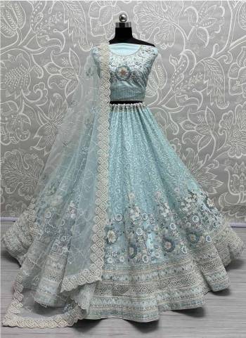For A Fancy Designer Look,Grab These Lehenga Choli With Dupatta in Fine Colored.These Lehenga And Choli Are Soft Net And Dupatta Are Fabricated On Soft Net Pair.Its Beautified With Designer Dori,Jari,Sequance,Thread Embroidery With Zarkan Diamond Work.
