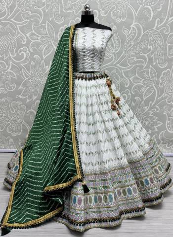 For A Fancy Designer Look,Grab These Lehenga Choli With Dupatta in Fine Colored.These Lehenga And Choli Are Chinon And Dupatta Are Fabricated On Chinon Pair.Its Beautified With Designer Printed,Crushed With Embroidery Work Lace Border.