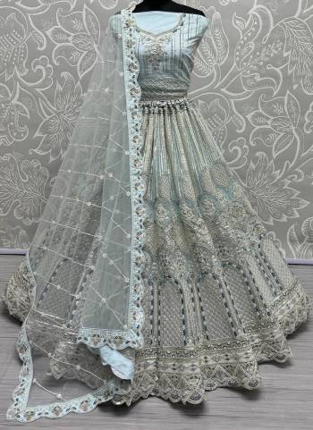 For A Fancy Designer Look,Grab These Lehenga Choli With Dupatta in Fine Colored.These Lehenga And Choli Are Net And Dupatta Are Fabricated On Soft Net Pair.Its Beautified With Designer Dori,Thread,Sequance Embroidery With Zarkan Diamond Work.