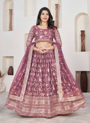 For A Designer Look,Grab These Lehenga Choli in Fine Colored.These Lehenga And Blouse Are Fabricated On Dolla Silk Pair With Net Dupatta.Its Beautified With Weaving Jacquard Designer With Embroidery Work.