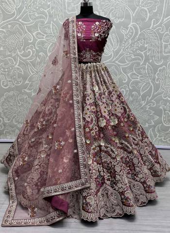 For A Fancy Designer Look,Grab These Lehenga Choli With Dupatta in Fine Colored.These Lehenga And Choli Are Velvet And Dupatta Are Fabricated On Soft Net Pair.Its Beautified With Pedding Color,Designer Jari,Sequance,Thread Embroidery With Zarkan Diamond Work.