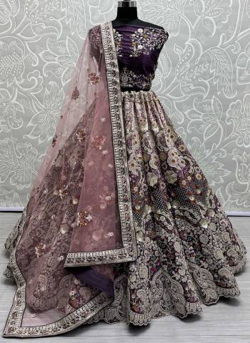 For A Fancy Designer Look,Grab These Lehenga Choli With Dupatta in Fine Colored.These Lehenga And Choli Are Velvet And Dupatta Are Fabricated On Soft Net Pair.Its Beautified With Pedding Color,Designer Jari,Sequance,Thread Embroidery With Zarkan Diamond Work.