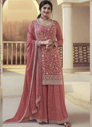 Garb These Designer Sharara Suits in Fine Colored Pair With Dupatta.These Top And Dupatta Are Fabricated On Chinon Pair With Chinon Bottom.Its Beautified With Designer Embroidery Work