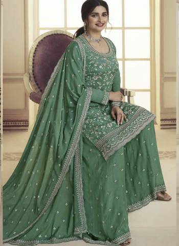 Garb These Designer Sharara Suits in Fine Colored Pair With Dupatta.These Top And Dupatta Are Fabricated On Chinon Pair With Chinon Bottom.Its Beautified With Designer Embroidery Work