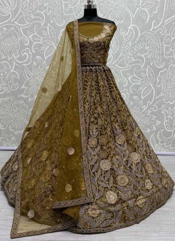 For A Fancy Designer Look,Grab These Lehenga Choli With Dupatta in Fine Colored.These Lehenga And Choli Are Net And Dupatta Are Fabricated On Soft Net Pair.Its Beautified With Designer Jari,Dori,Sequance,Thread Embroidery Work.