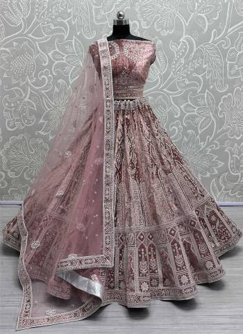 For A Fancy Designer Look,Grab These Lehenga Choli With Dupatta in Fine Colored.These Lehenga And Choli Are Velvet And Dupatta Are Fabricated On Soft Net Pair.Its Beautified With Designer Jari,Sequance,Thread Embroidery With Zarkan Diamond Work.