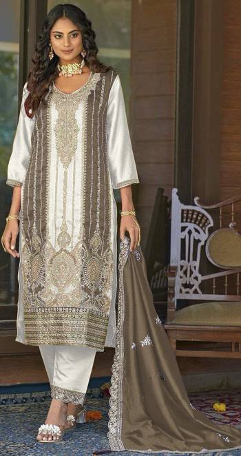 Garb These Designer Suit in Fine Colored Pair With Bottom And Dupatta.These Top Are Vichitra And Dupatta Are Fabricated On Vichitra Pair With Santoon Bottom.Its Beautified With Santoon Inner.Its Beautified With Heavy Designer Embroidery Work.