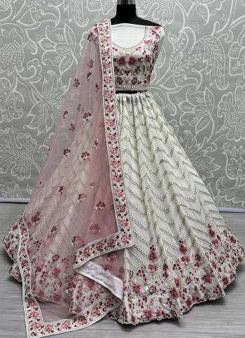 For A Fancy Designer Look,Grab These Lehenga Choli With Dupatta in Fine Colored.These Lehenga And Choli Are Georgette And Dupatta Are Fabricated On Soft Net Pair.Its Beautified With Designer Jari,Multy Thread Embroidery With Zarkan Diamond Work.