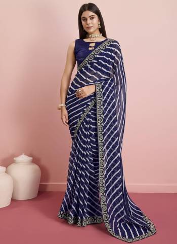 Looking These Designer Saree in Fine Colored.These Saree Are Georgette And Blouse is Art Silk Fabricated.Its Beautified With Designer Laheriya Printed, Embroidery Work Lace Border.