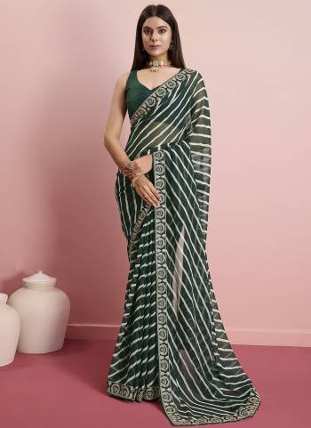 Looking These Designer Saree in Fine Colored.These Saree Are Georgette And Blouse is Art Silk Fabricated.Its Beautified With Designer Laheriya Printed, Embroidery Work Lace Border.