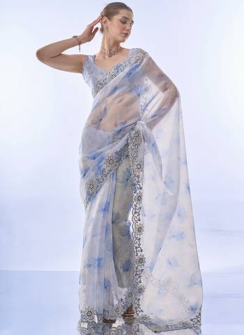 Grab These Party Wear Saree in Fine Colored.These Saree is Fabricated On Milky Organza Pair With Art Silk Blouse.Its Beautified With Designer  Work.