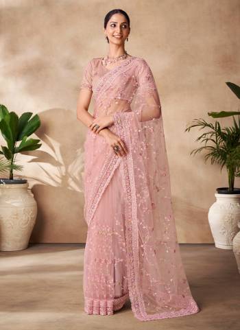 Looking These Party Wear Saree in Fine Colored.These Saree Are Net And Blouse is Fabricated On Net Pair.Its Beautified With Designer Heavy Thread,Sequance Embroidery,Zarkan Work.