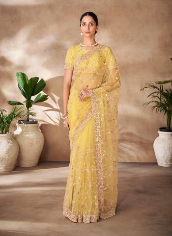 Looking These Party Wear Saree in Fine Colored.These Saree Are Net And Blouse is Fabricated On Net Pair.Its Beautified With Designer Heavy Thread,Sequance Embroidery,Zarkan Work.