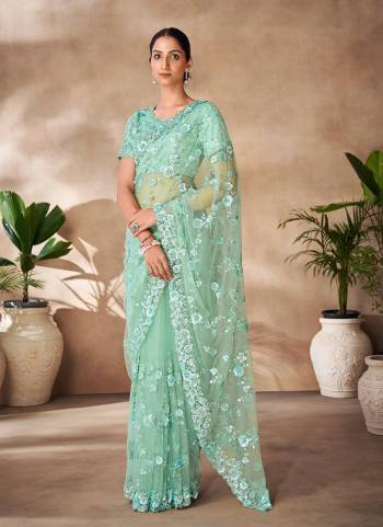 Looking These Party Wear Saree in Fine Colored.These Saree Are Net And Blouse is Fabricated On Net Pair.Its Beautified With Designer Heavy Thread,Sequance Embroidery,Zarkan Work.