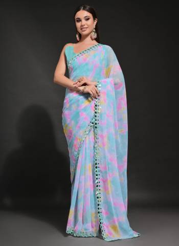 Garb These Party Wear Saree in Fine Colored.These Saree Are Georgette And Blouse is Mono Banglori Fabricated.Its Beautified With Designer Prizam Printed,Mirror Work Lace Border.