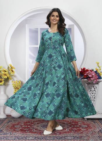 Garb These Beautiful Looking Readymade Long Kurti With Dupatta.These Kurti Are Rayon And Dupatta Are Nazmin Fabricated.Its Beautified With Disigner Printed,HandWork.