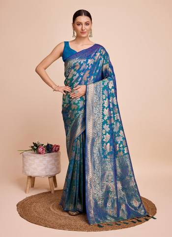 Garb This Partywear Saree Paired With Blouse.This Saree And Blouse Are Handloom Silk Based Fabric With Weaving Copper Jari Designer. Buy This Pretty Saree Now.