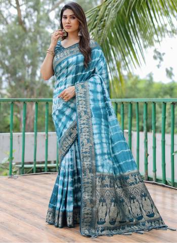 Garb These Festive Wear Saree in Fine Colored.These Saree And Blouse is Fabricated On Dola Silk.Its Beautified With Wevon Border Pallu Designer With Sibori Printed.