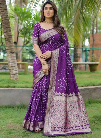 Looking These Party Wear Saree in Fine Colored.These Saree And Blouse is Fabricated On Dola Silk.Its Beautified With Wevon Designer With Handmade Bandhej Printed.