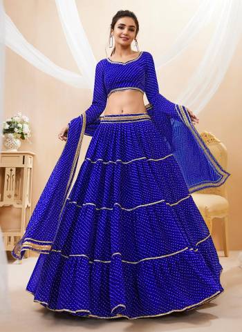 For A Designer Look,Grab These Lehenga Choli in Fine Colored.These Lehenga Are Georgette And Blouse Are Fabricated On Georgette Pair With Dupatta Are Georgette.Its Beautified With Designer Laheriya Printed With Lace.