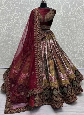 For A Fancy Designer Look,Grab These Lehenga Choli With 2 Dupatta in Fine Colored.These Lehenga And Choli Are Velvet And Dupatta Are Fabricated On Soft Net & Velvet Pair.Its Beautified With Designer Velvet & Silk Patch,Dori, Muty Thread,Sequance Embroidery With Diamond Work.