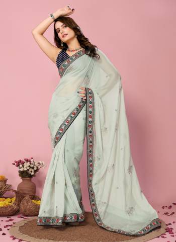 Looking These Party Wear Saree in Fine Colored.These Saree Are Organza And Blouse is Art Silk Fabricated.Its Beautified With Designer Coding,Sequance Embroidery Work With Printed Blouse.