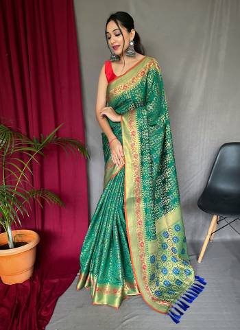 Attrective This Partywear Saree Paired With Blouse.This Saree And Blouse Are Patola Silk Based Fabric With Weaving Jacquard Jari Designer. Buy This Pretty Saree Now.