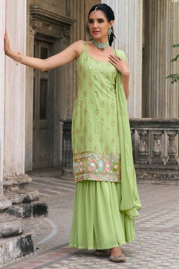 Attrective These Sharara Suit in Fine Colored Pair With Bottom And Dupatta.These Top And Dupatta Are Fabricated On Faux Georgette Pair With Faux Georgette Bottom.Its Beautified With Designer Multy Thread,Sequance Embroidery Work.