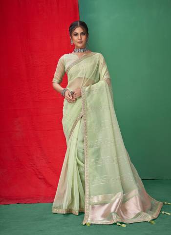 Looking These Party Wear Saree in Fine Colored.These Saree Are Organza And Blouse is Fabricated On Organza.Its Beautified With Wevon Lining Designer With Coding,Sequance,Gota Patti Embroidery Work.