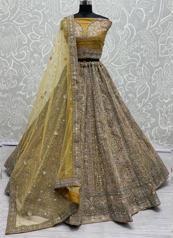 For A Fancy Designer Look,Grab These Lehenga Choli With Dupatta in Fine Colored.These Lehenga And Choli Are Net And Dupatta Are Fabricated On Soft Net Pair.Its Beautified With Designer Rose Pattern,Sequance,Mirror,Various Jari Embroidery Work.