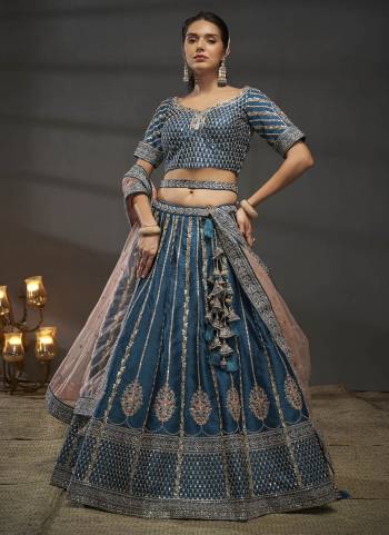 Attrective Looking This Partywear Fine Color Heavy Designer Choli Fabric Silk And Lahenga Silk And Dupatta Net In Fabricated Beautified With Attrective Designer Thread,Sequance,Coding Embroidery,Moti,Zarkan Work. Buy Now.