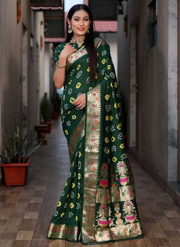 Looking These Party Wear Saree in Fine Colored.These Saree And Blouse is Fabricated On Dola Silk.Its Beautified With Wevon Matha Border Pallu Designer With Hand Made Bandhej Printed.