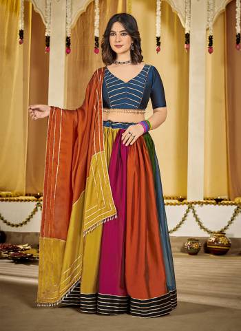 Looking These Navratri Special Lehenga Choli in Fine Colored.These Lehenga Are Rangoli Silk Choli Are Rangoli Silk And Dupatta Are Fabricated On Rangoli Silk Pair.Its Beautified With Designer Thread,Mirror Embroidery Work.